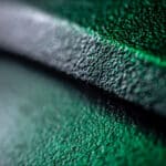 Extreme close up of plastic surface dark background. Abstract super macro background